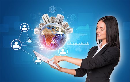 simsearch:400-07821752,k - Beautiful businesswomen in suit using digital tabletEarth with buildings. Graphs as backdrop. Element of this image furnished by NASA Foto de stock - Royalty-Free Super Valor e Assinatura, Número: 400-07821857