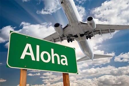 Aloha Green Road Sign and Airplane Above with Dramatic Blue Sky and Clouds. Foto de stock - Super Valor sin royalties y Suscripción, Código: 400-07821892