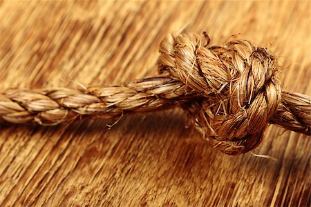 simsearch:400-06106317,k - Close up of rope knot on wooden background Photographie de stock - Aubaine LD & Abonnement, Code: 400-07821971