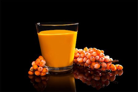 Sea buckthorn juice and berries isolated on black background. Alternative medicine. Stock Photo - Budget Royalty-Free & Subscription, Code: 400-07822698