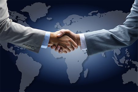 Handshake with map of the world in background Stock Photo - Budget Royalty-Free & Subscription, Code: 400-07823991