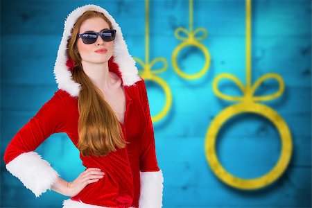 Cool santa girl wearing sunglasses against blurred christmas background Stock Photo - Budget Royalty-Free & Subscription, Code: 400-07834014
