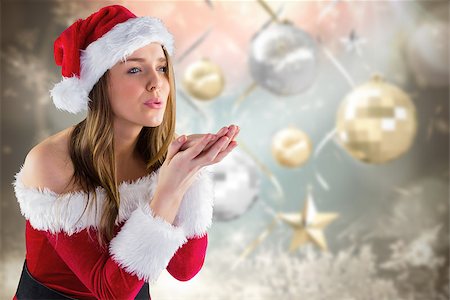 simsearch:400-07834588,k - Sexy santa girl blowing over hands against blurred christmas background Fotografie stock - Microstock e Abbonamento, Codice: 400-07834173