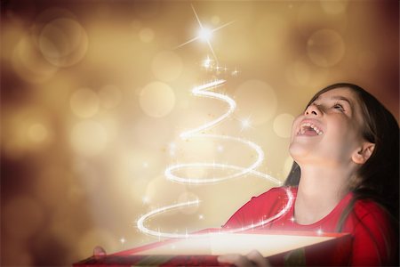 Happy girl opening gift box against orange abstract light spot design Stock Photo - Budget Royalty-Free & Subscription, Code: 400-07834299