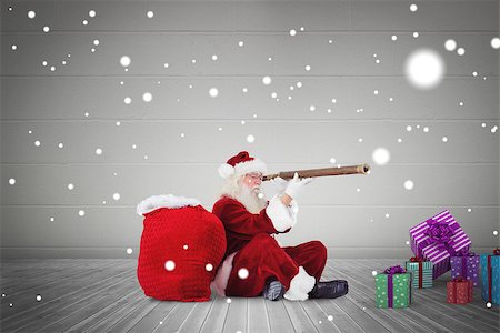 Santa looking through telescope against grey room Stock Photo - Budget Royalty-Free & Subscription, Code: 400-07834606