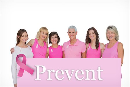 simsearch:400-06932882,k - Smiling women wearing pink for breast cancer awareness against pink card Stock Photo - Budget Royalty-Free & Subscription, Code: 400-07834840