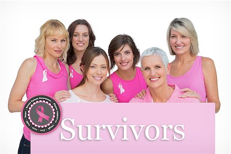 simsearch:400-06932887,k - Happy women posing and wearing pink for breast cancer against pink card Fotografie stock - Microstock e Abbonamento, Codice: 400-07834863