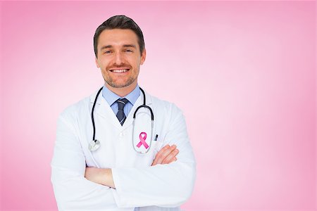 simsearch:400-04217553,k - Handsome young doctor with arms crossed against pink vignette Foto de stock - Royalty-Free Super Valor e Assinatura, Número: 400-07834914