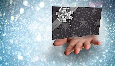 Hand bursting through paper against white snow and stars design Stock Photo - Budget Royalty-Free & Subscription, Code: 400-07834964