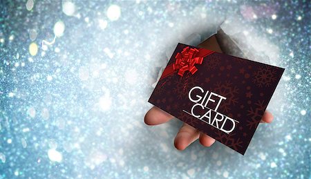 simsearch:400-07834588,k - Hand bursting through paper against gift card with festive bow Fotografie stock - Microstock e Abbonamento, Codice: 400-07834966