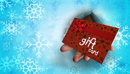 simsearch:400-07834588,k - Hand bursting through paper against gift card with festive bow Fotografie stock - Microstock e Abbonamento, Codice: 400-07834971