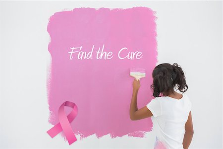 simsearch:400-07834992,k - Young woman painting her wall in pink against pink breast cancer awareness ribbon Fotografie stock - Microstock e Abbonamento, Codice: 400-07834984