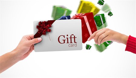simsearch:400-07834588,k - Hands holding card against gift card with festive bow Fotografie stock - Microstock e Abbonamento, Codice: 400-07835024