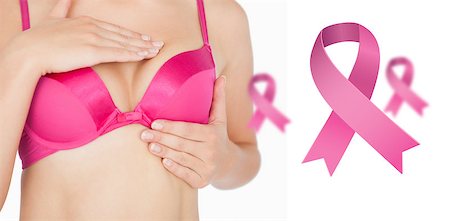 simsearch:400-06870717,k - Woman performing self breast examination against pink breast cancer awareness ribbons Stock Photo - Budget Royalty-Free & Subscription, Code: 400-07835107