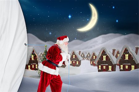 snowy night at home - Santa claus pulling rope against cute christmas village at night Stock Photo - Budget Royalty-Free & Subscription, Code: 400-07835325