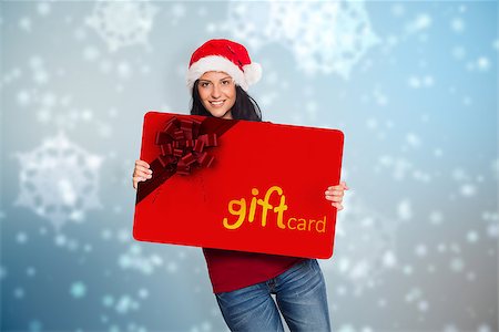 simsearch:400-07834588,k - Woman holding a white sign against digitally generated delicate snowflake design Fotografie stock - Microstock e Abbonamento, Codice: 400-07835381