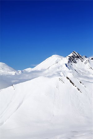 simsearch:400-08669918,k - Winter snowy mountains at nice day. Caucasus Mountains, Georgia, Gudauri. View from ski resort. Photographie de stock - Aubaine LD & Abonnement, Code: 400-07836198