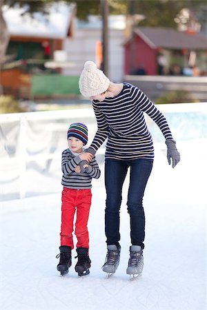simsearch:400-08318057,k - family of two having fun ice skating together at winter Stock Photo - Budget Royalty-Free & Subscription, Code: 400-07836388
