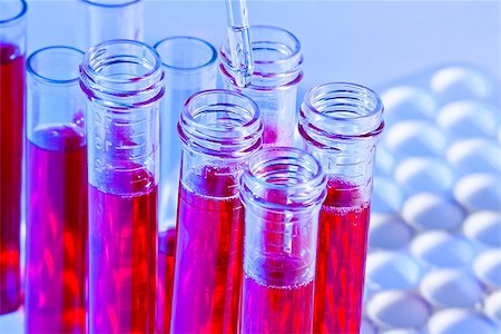 simsearch:632-01140524,k - detail of pipette and test tubes with red liquid in laboratory on blue light tint background Photographie de stock - Aubaine LD & Abonnement, Code: 400-07836411
