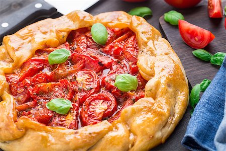 Galette with tomato and basil on a table Stock Photo - Budget Royalty-Free & Subscription, Code: 400-07836807