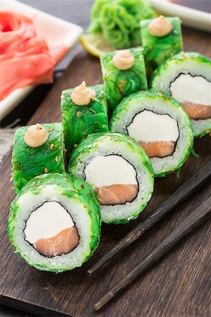 Salmon sushi rolls covered with chuka seaweed Stock Photo - Budget Royalty-Free & Subscription, Code: 400-07836800