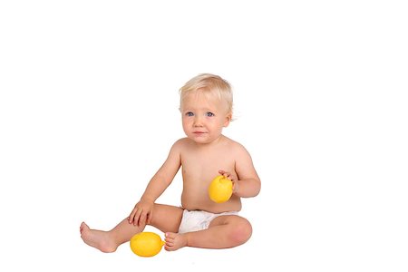 One year old boy with lemon on white background Stock Photo - Budget Royalty-Free & Subscription, Code: 400-07836860