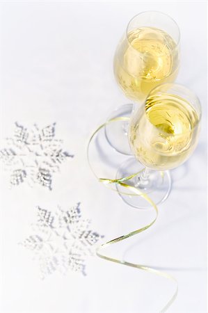 Two glasses of wine and snowflakes on a white background, top view Stock Photo - Budget Royalty-Free & Subscription, Code: 400-07836938