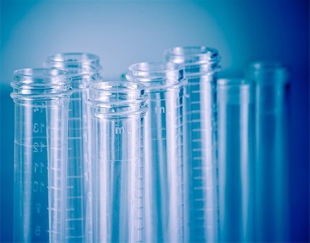 detail of the test tubes in laboratory on blue light tint background Foto de stock - Super Valor sin royalties y Suscripción, Código: 400-07837459