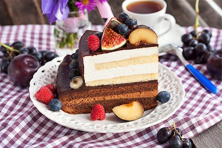 Piece of chocolate layer cake with cream and fresh fruit Stock Photo - Budget Royalty-Free & Subscription, Code: 400-07830246