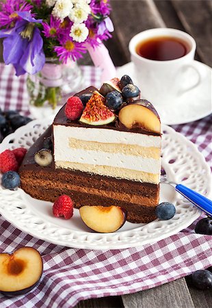 Piece of chocolate layer cake with cream and fresh fruit Stock Photo - Budget Royalty-Free & Subscription, Code: 400-07830247