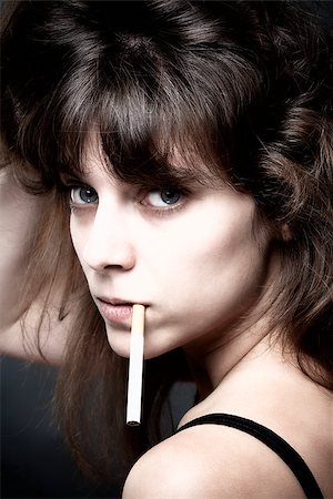 pictures of girls smoking cigarettes - Portrait of a Young Woman with a Cigarette Stock Photo - Budget Royalty-Free & Subscription, Code: 400-07830742