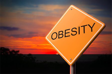 Obesity on Warning Road Sign on Sunset Sky Background. Stock Photo - Budget Royalty-Free & Subscription, Code: 400-07830908