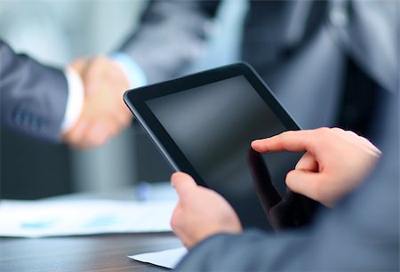 Businessman holding digital tablet Stock Photo - Budget Royalty-Free & Subscription, Code: 400-07831336