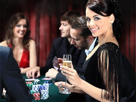 Poker players sitting around a table at a casino Stock Photo - Budget Royalty-Free & Subscription, Code: 400-07831339
