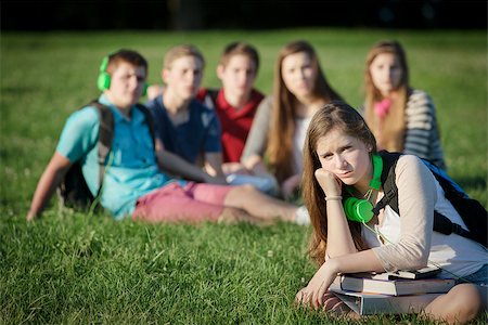 Lonely female teen student sitting near group Stock Photo - Budget Royalty-Free & Subscription, Code: 400-07831410