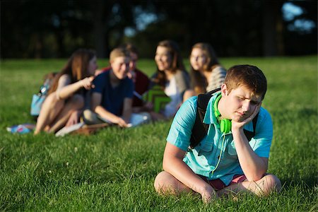 peer pressure - Group of teen bullying sad student sitting outdoors Foto de stock - Super Valor sin royalties y Suscripción, Código: 400-07831422