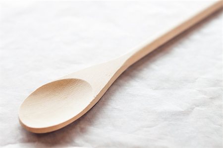 Wooden spoon on baking paper, stock photo Stockbilder - Microstock & Abonnement, Bildnummer: 400-07831435