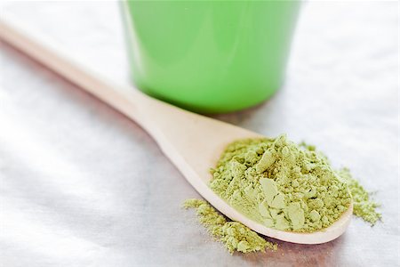 Powdered green tea with wooden spoon, stock photo Stockbilder - Microstock & Abonnement, Bildnummer: 400-07831432