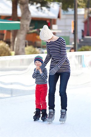 simsearch:400-08318057,k - family of two having fun ice skating together at winter Stock Photo - Budget Royalty-Free & Subscription, Code: 400-07831497