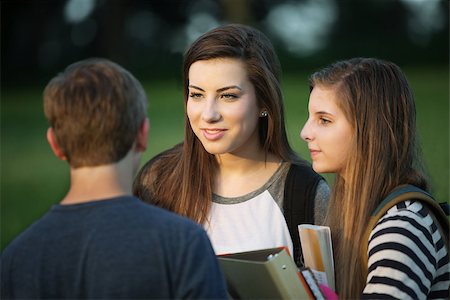 Group of three young Caucasian students talking outdoors Stock Photo - Budget Royalty-Free & Subscription, Code: 400-07831969