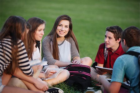 Happy young female student talking with friends Stock Photo - Budget Royalty-Free & Subscription, Code: 400-07831961