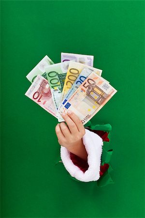 simsearch:695-05780265,k - Money for the christmas shopping rush handed to you Photographie de stock - Aubaine LD & Abonnement, Code: 400-07831983