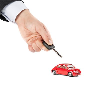 toy car and car key concept for insurance, buying, renting, fuel or service and repair costs, on white background Stock Photo - Budget Royalty-Free & Subscription, Code: 400-07833398