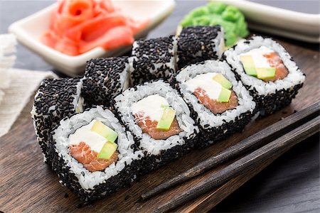simsearch:400-05682309,k - Sushi roll covered with sesame and salmon stuffed Stock Photo - Budget Royalty-Free & Subscription, Code: 400-07833549