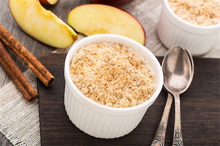 Apple crumble dessert with cinnamon in a ceramic bowl Stock Photo - Budget Royalty-Free & Subscription, Code: 400-07833591