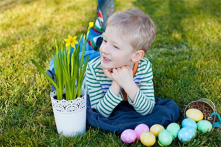 field of daffodil pictures - smiling positive boy with flowers and easter eggs at spring time Photographie de stock - Aubaine LD & Abonnement, Code: 400-07840164