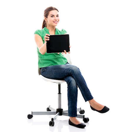 simsearch:6109-06194868,k - Beautiful female student sitting on a chair showing something on a tablet, isolated over a white background Stock Photo - Budget Royalty-Free & Subscription, Code: 400-07894165