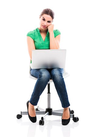 Female student sitting on a chair with a laptop and thinking, isolated over a white background Foto de stock - Super Valor sin royalties y Suscripción, Código: 400-07894163