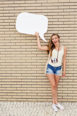 female models balloons - Beautiful and young teenager holding a thought balloon, in front of a brick wall Stock Photo - Budget Royalty-Free & Subscription, Code: 400-07894222