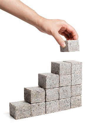 Man stacking blocks made of granite rock. Stock Photo - Budget Royalty-Free & Subscription, Code: 400-07894458